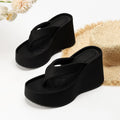 Pair of thick soled slippers for women with PU upper and rubber sole