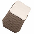 Baby stroller sleeping bag with thick filling shown in beige colour on a pushchair