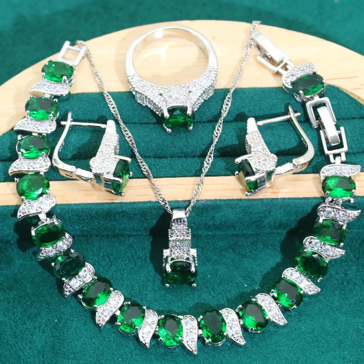 Bridal zircon jewellery four-piece set showing necklace, earrings, bracelet and ring with water wave chain