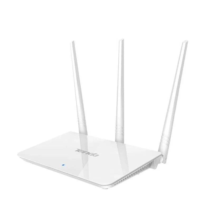 White dual-band wireless broadband router with UK-style three-pin plug on a wooden desk.