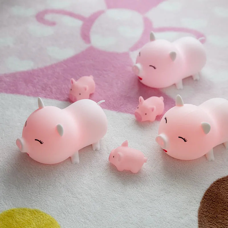 Dudu pig cartoon night light with silicone lampshade and warm yellow LED glow on a bedside table