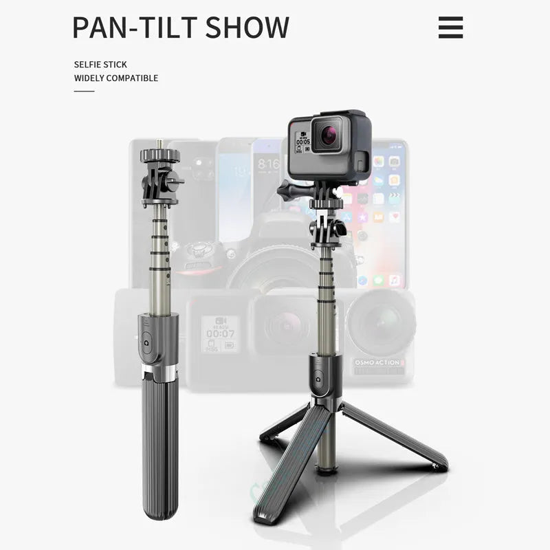 Black aluminium iPhone tripod selfie stick extended to 700mm on a table.