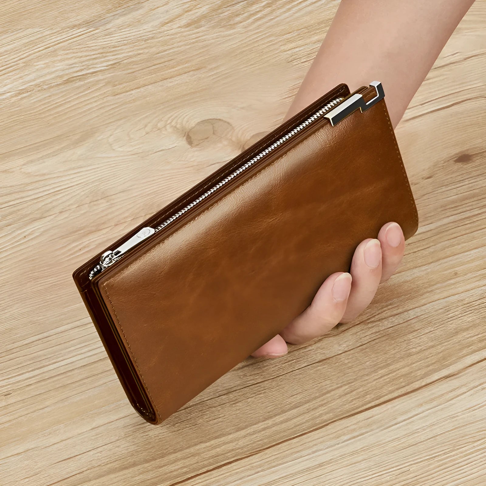Brown solid colour cowhide leather wallet with contrast stitching laid open showing card slots and cash compartment