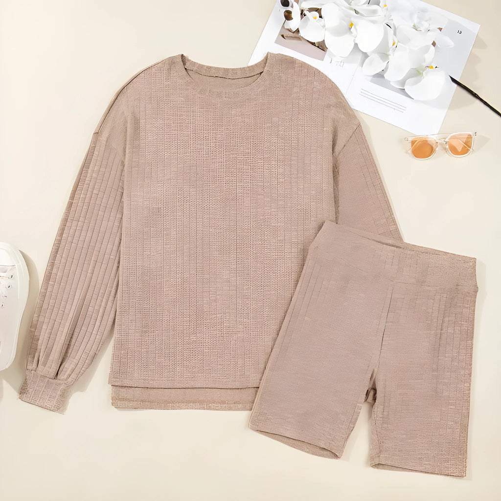 Dark khaki ribbed lantern sleeve sweater and motorcycle knit shorts set on display