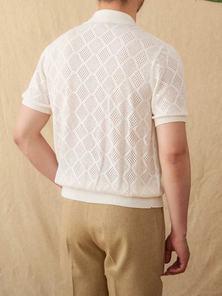 Light brown cotton short sleeve cardigan with zipper front and lapel collar on a hanger.
