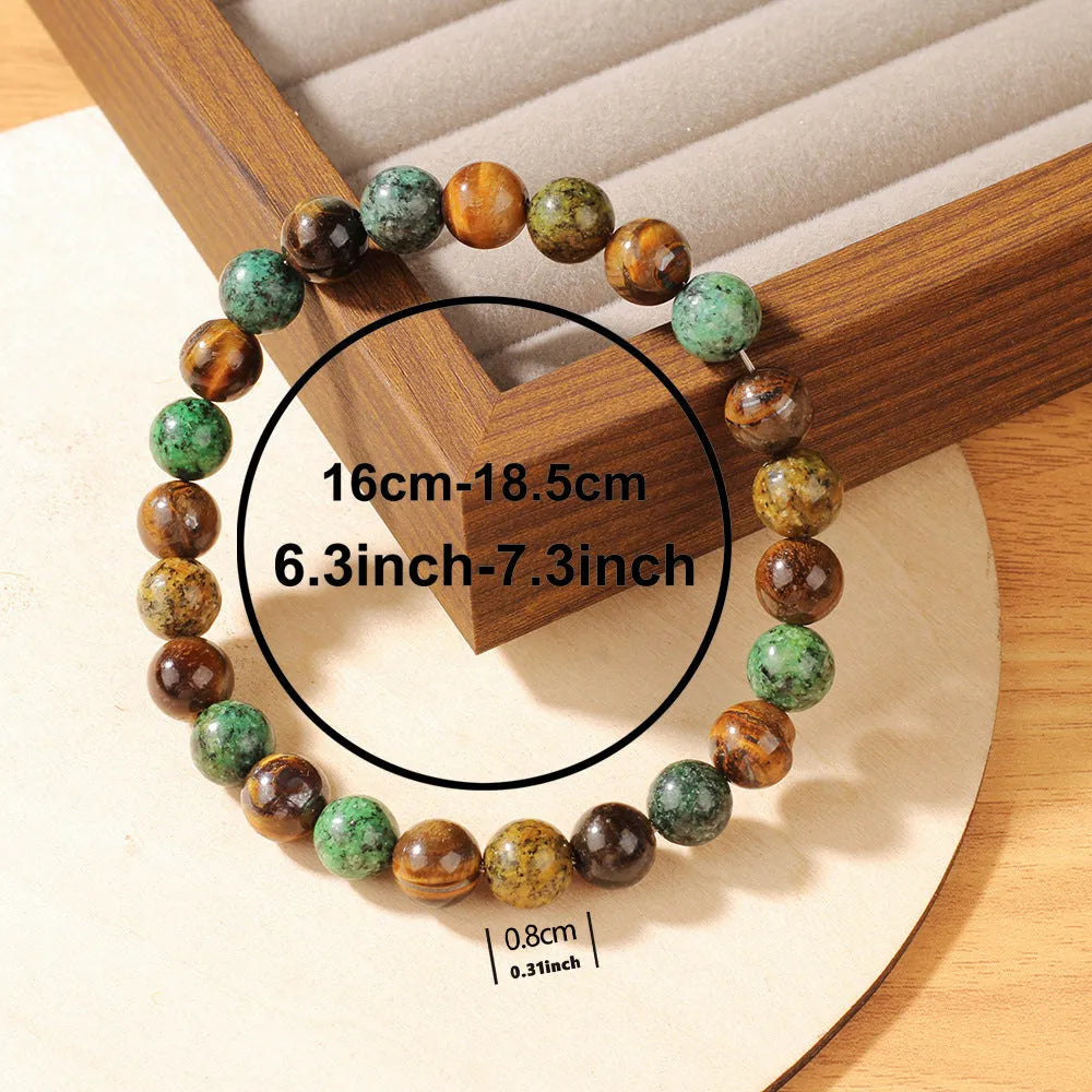 Tigereye natural stone fortune bracelet showing antique floral design and handmade construction