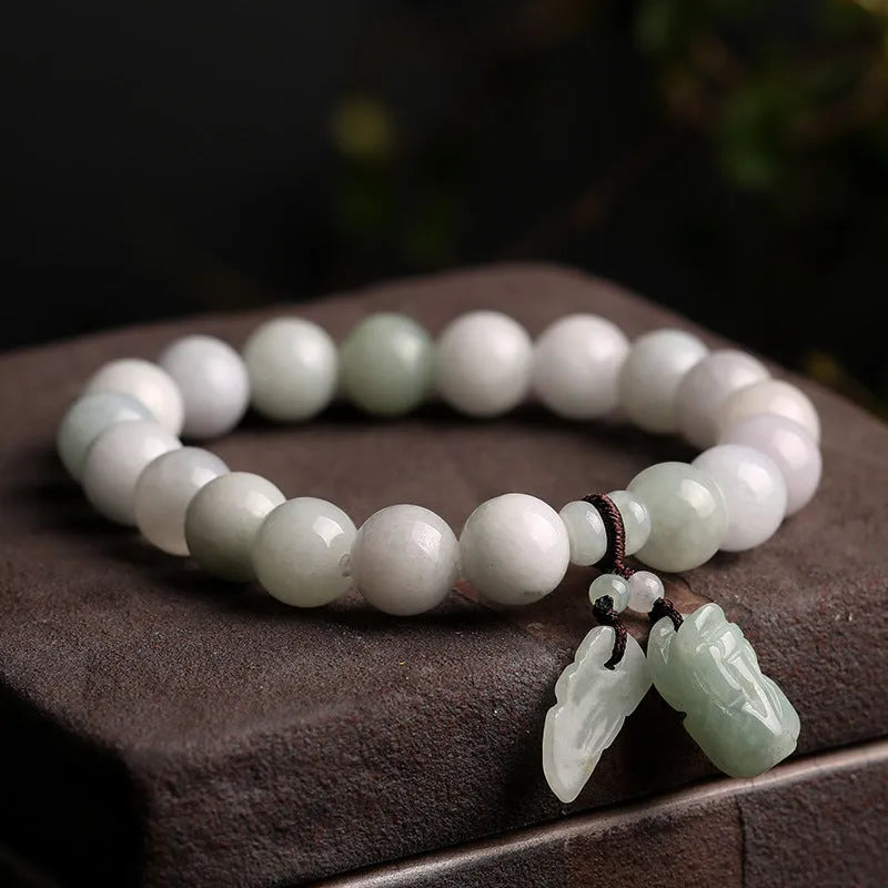Natural emerald green jade bracelet with silver-plated hanging charms including Maitreya Buddha