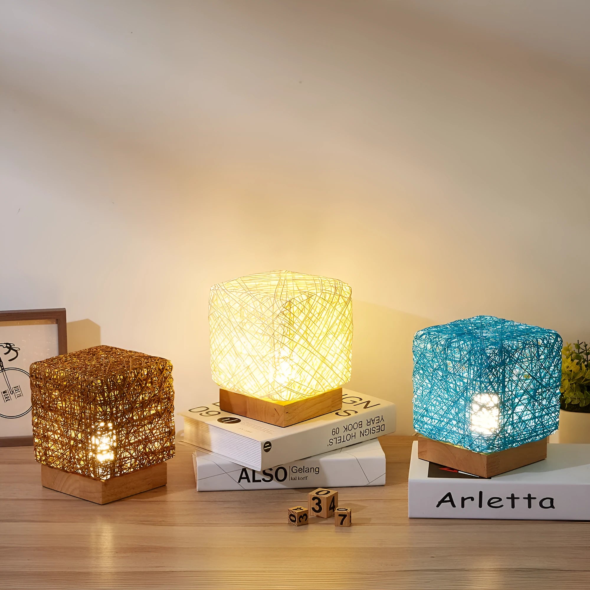 Hand-knit square LED desk lamp with bamboo rattan twine in beige, USB charging, on a wooden desk