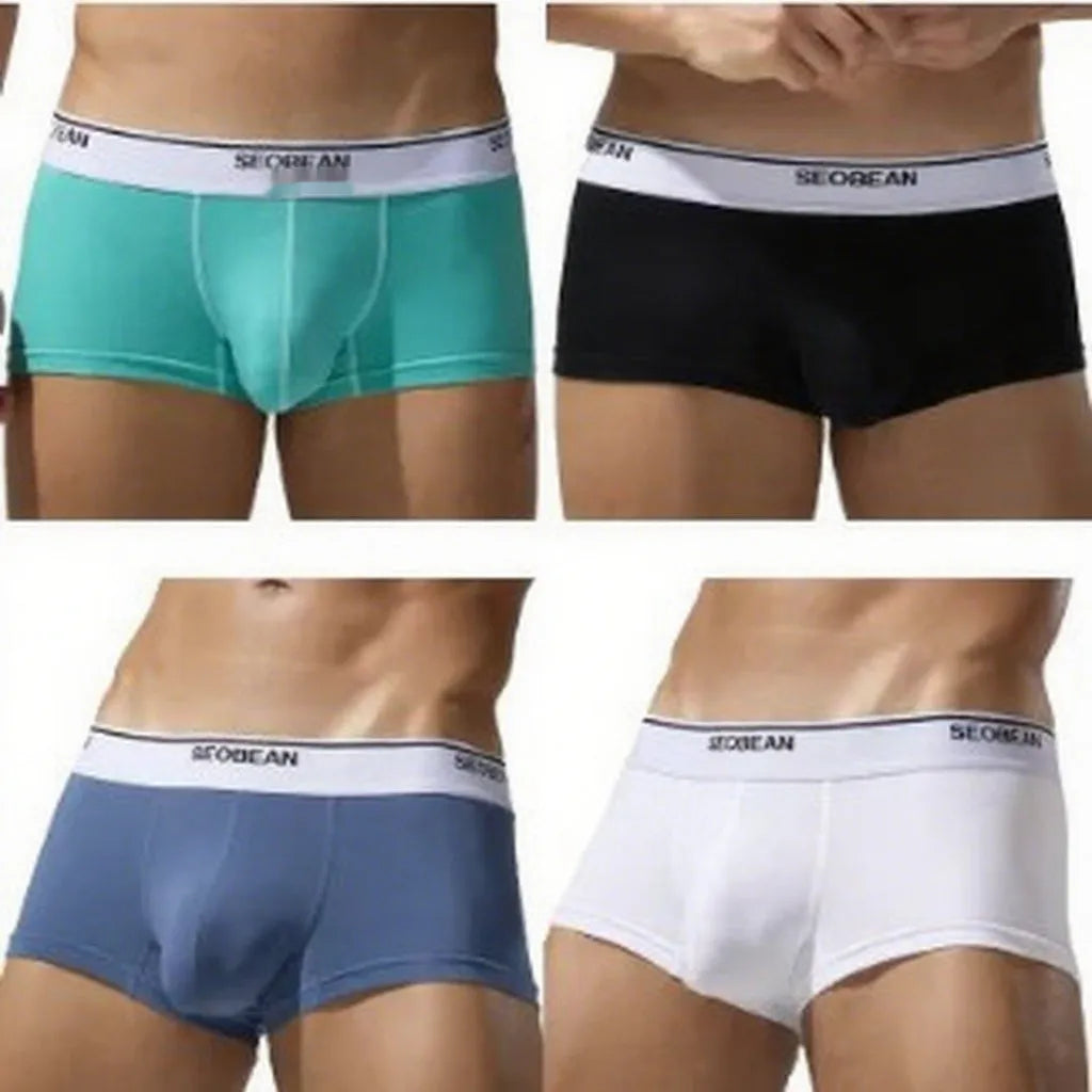 Men's solid colour cotton low-waist boxer shorts laid flat, showing the classic fit and knitted fabric texture.