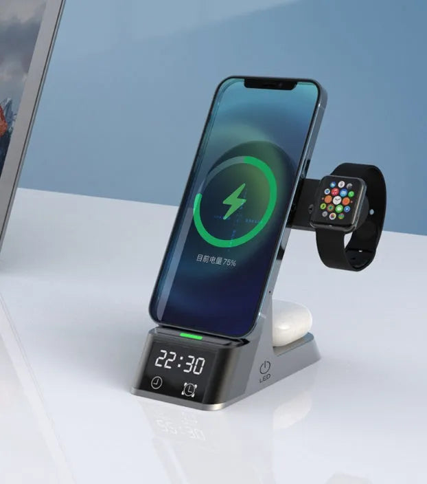 Black six-in-one wireless charging alarm clock showing phone, Apple Watch, and earphones on charging areas.