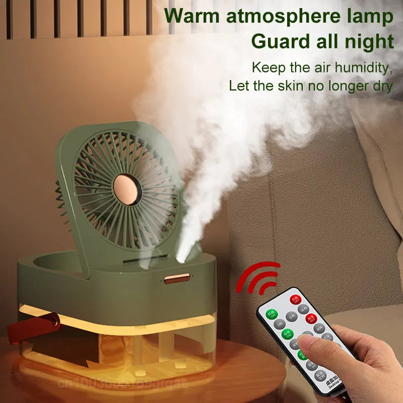 White or green USB desktop fan humidifier with remote control on a wooden desk.