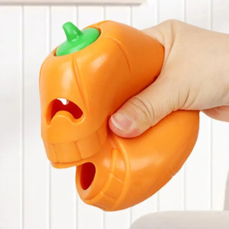 Yellow pumpkin-shaped TPR dog chew toy for aggressive chewers, showing textured ridges.