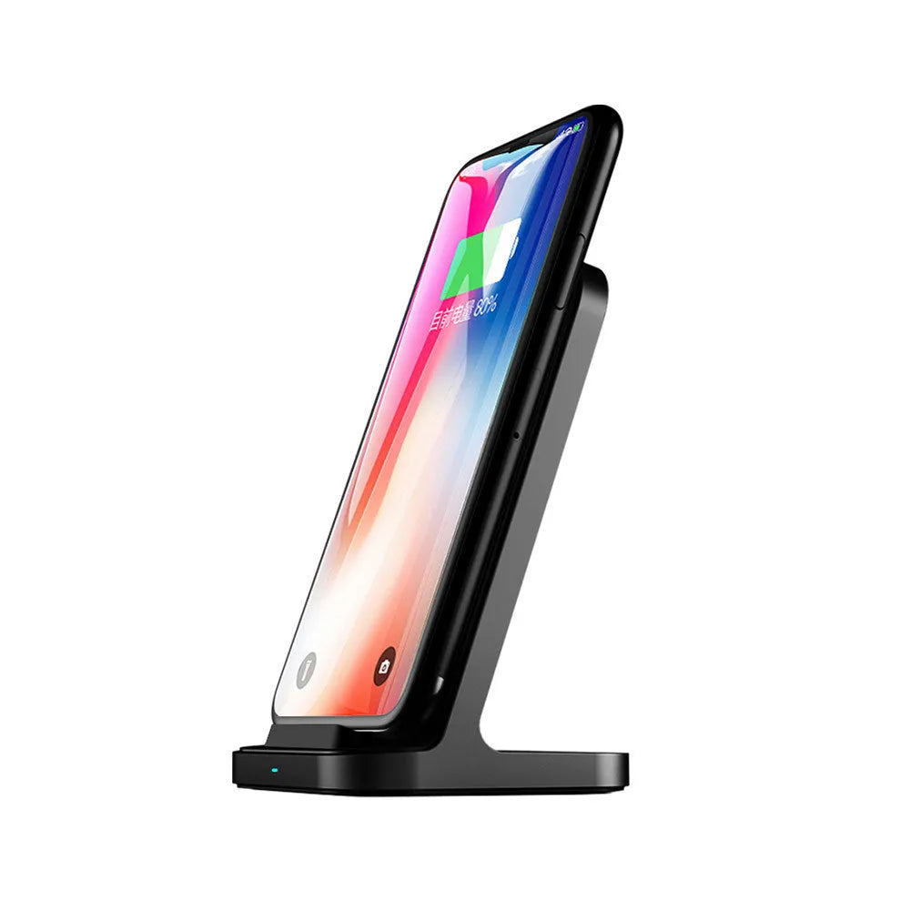 Dark grey vertical wireless charging stand for Apple phones on desktop