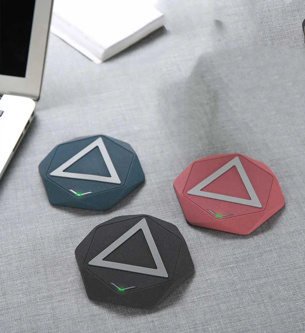 Frosted wireless Qi charger with LED indicator in black colour on a desk