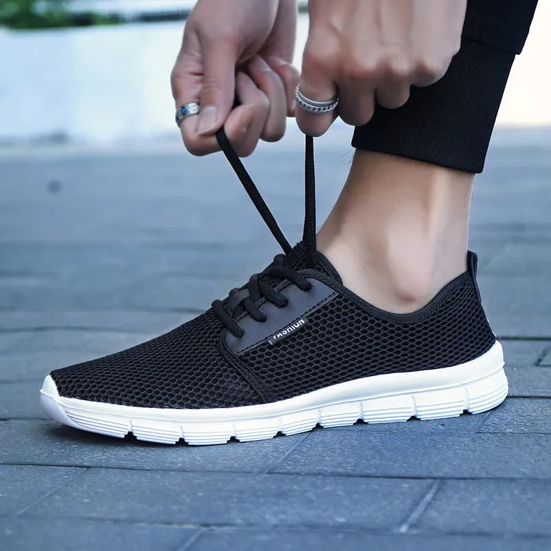 Men's casual running shoes with mesh upper and MD sole in black colour option for summer sportswear