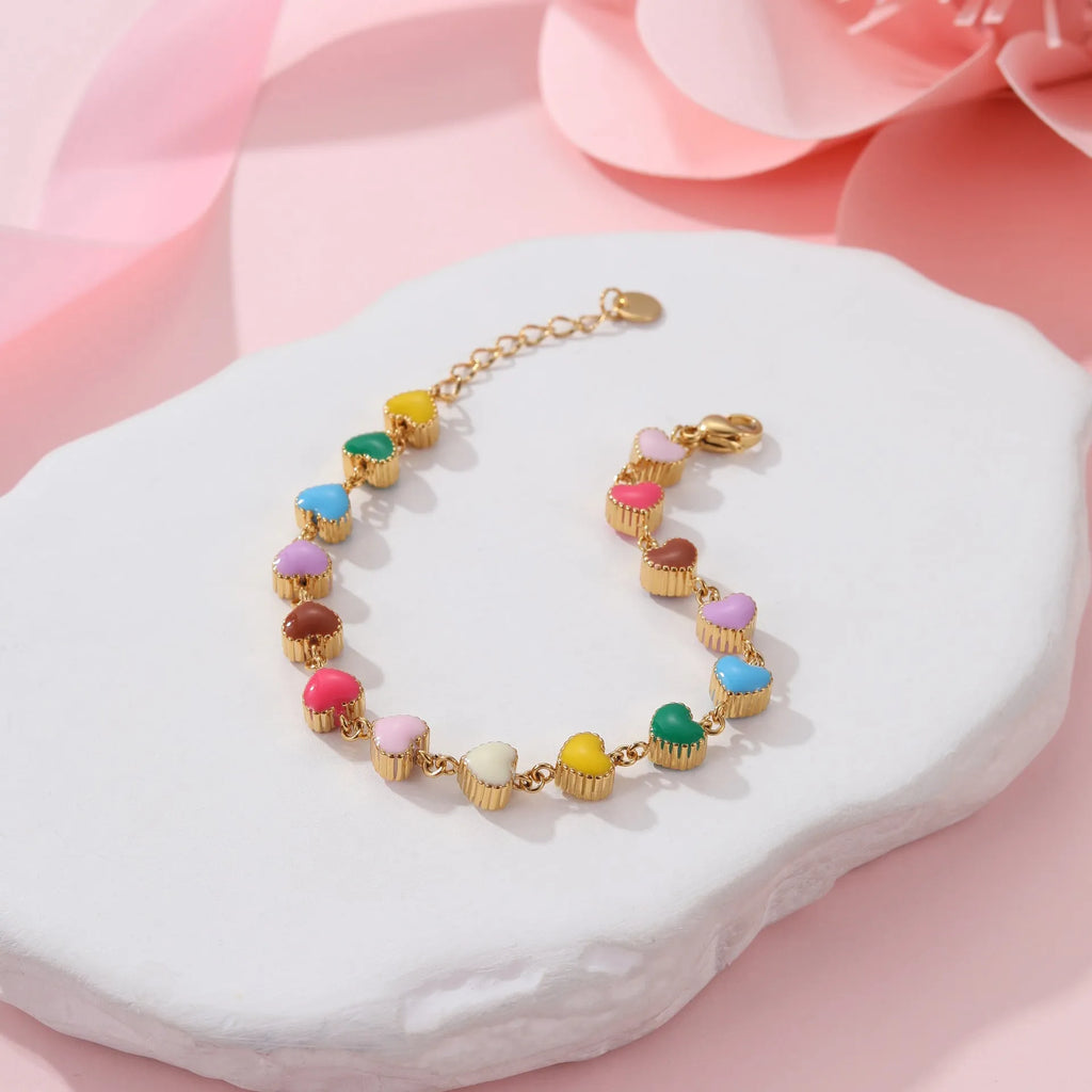 Women's gold bracelet with love heart design, stainless steel construction, and electroplated finish
