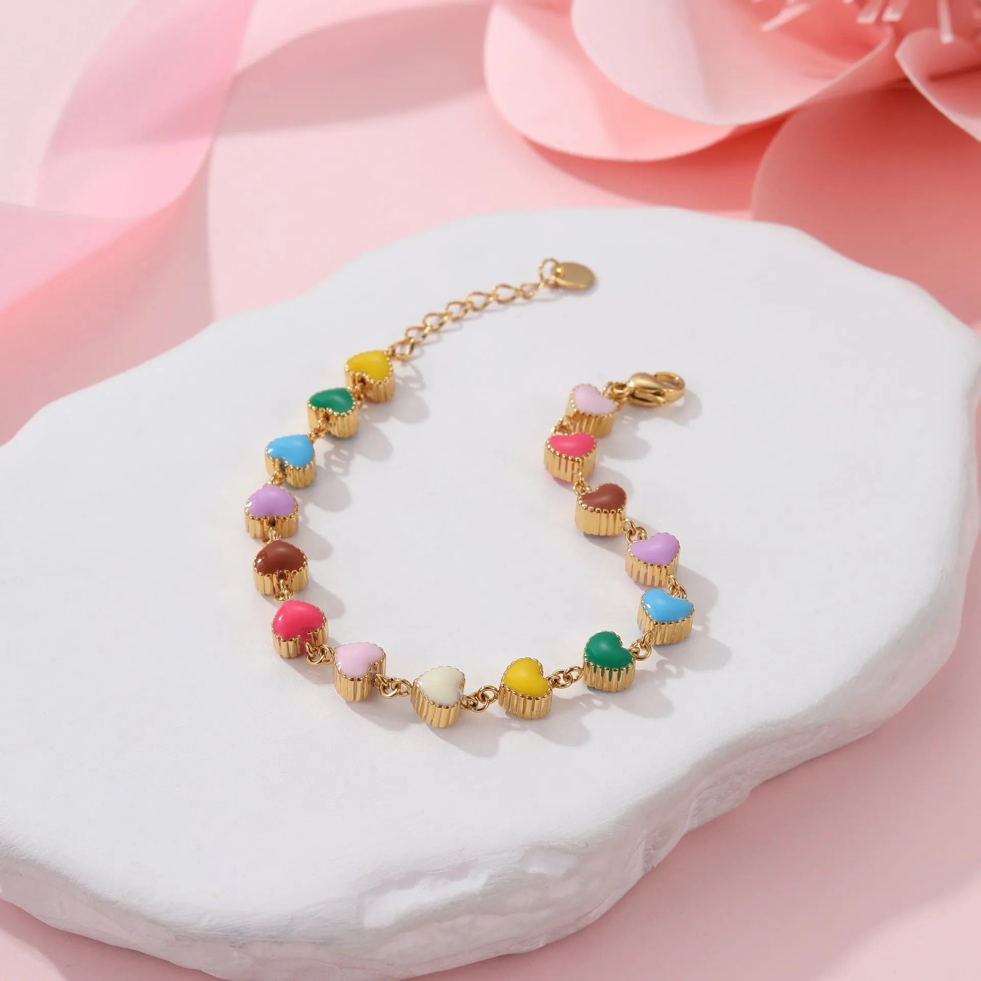 Women's gold bracelet with love heart design, stainless steel construction, and electroplated finish