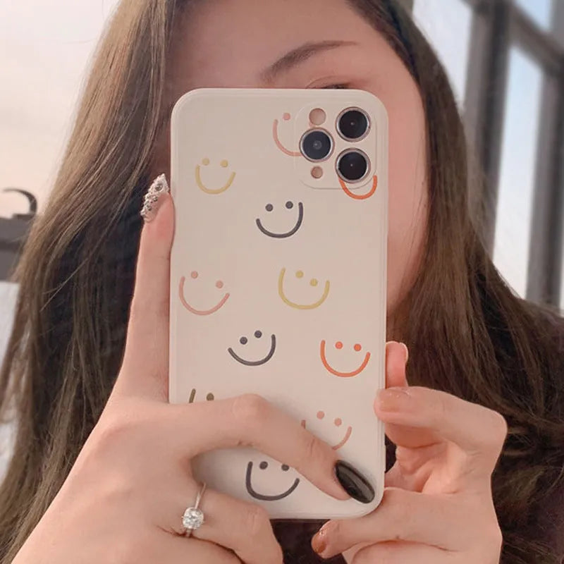 Simple Case Silicone iPhone case in graffiti design, showing Full Screen Smiley, Rainbow, and Watercolor colour options.