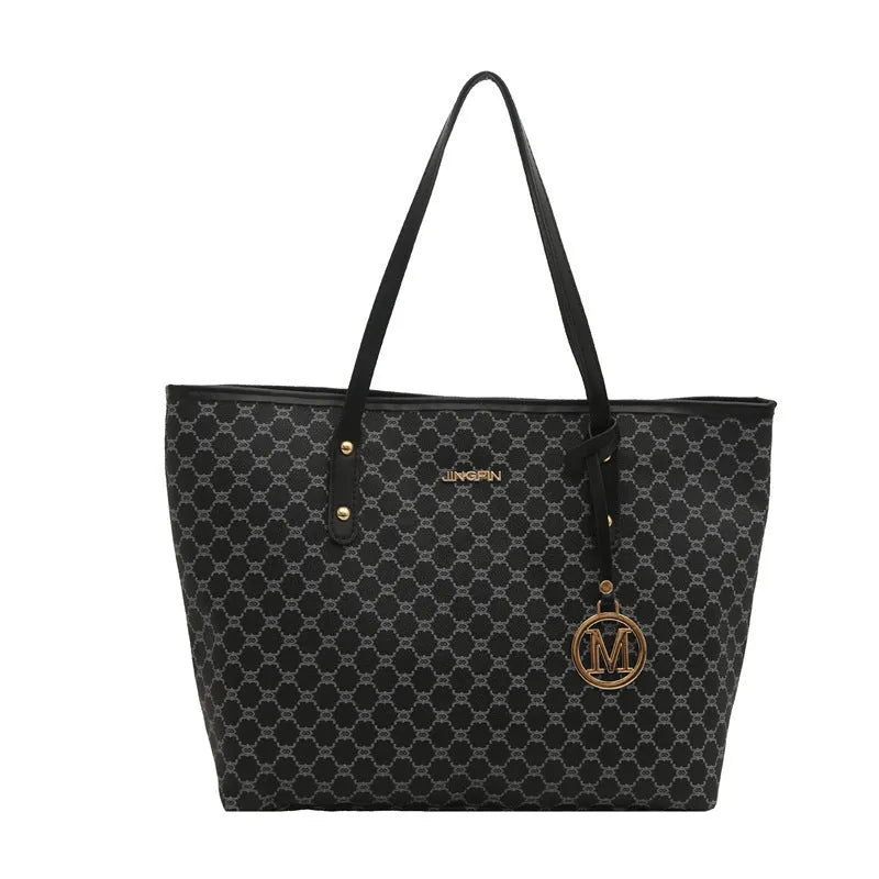 Western style women's shoulder bag in PU leather with contrast stitching, shown in black.