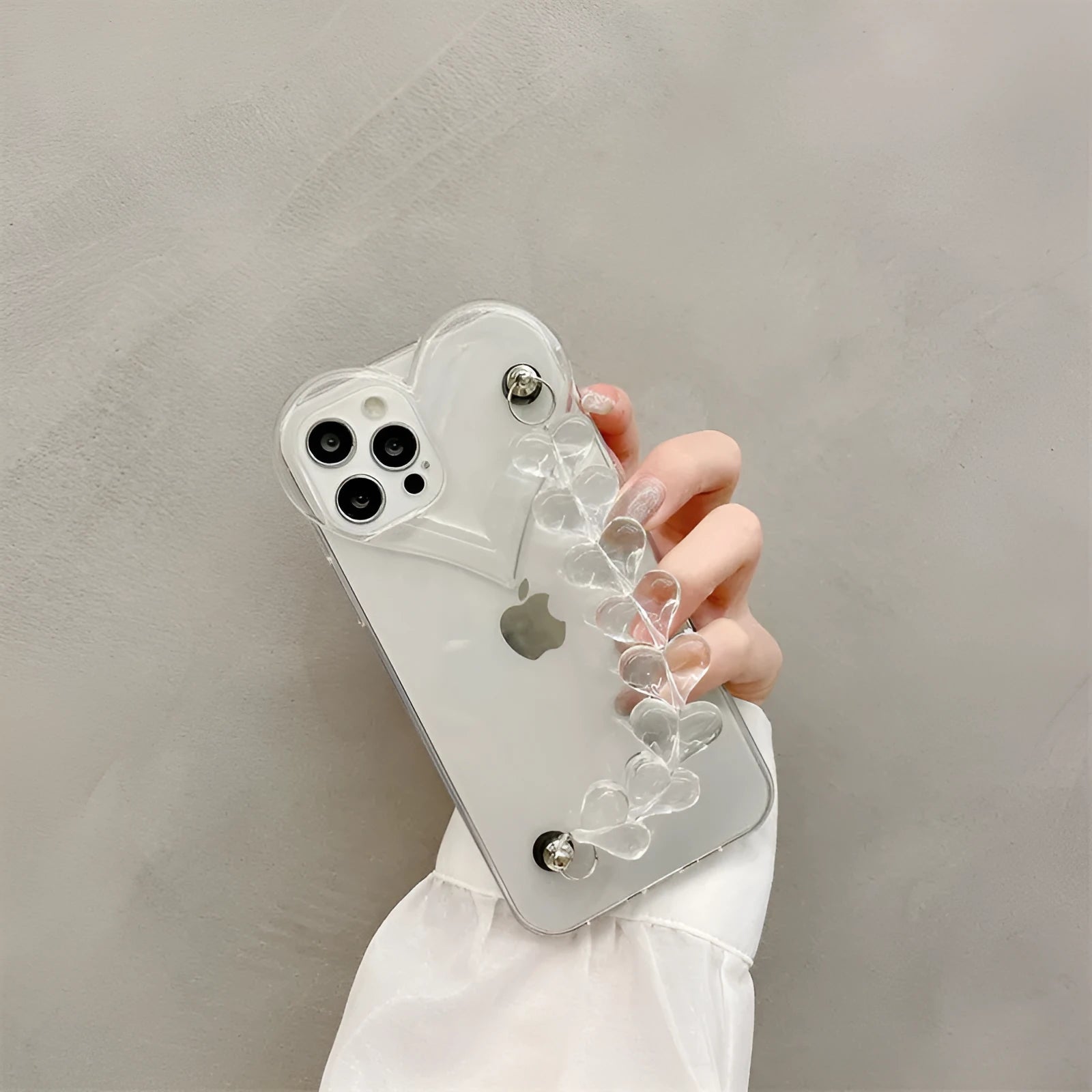 Transparent iPhone case with love heart chain bracelet design on soft TPU material
