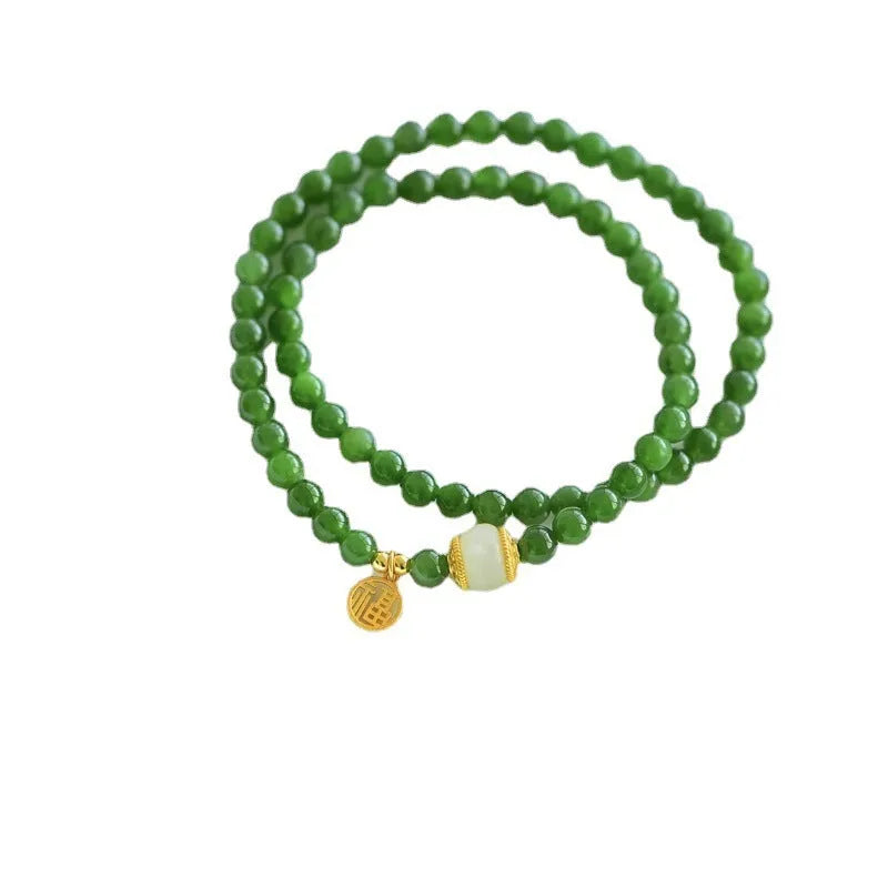 Natural Hetian jade double circle bracelet with 6mm beads and a carved fu character charm.