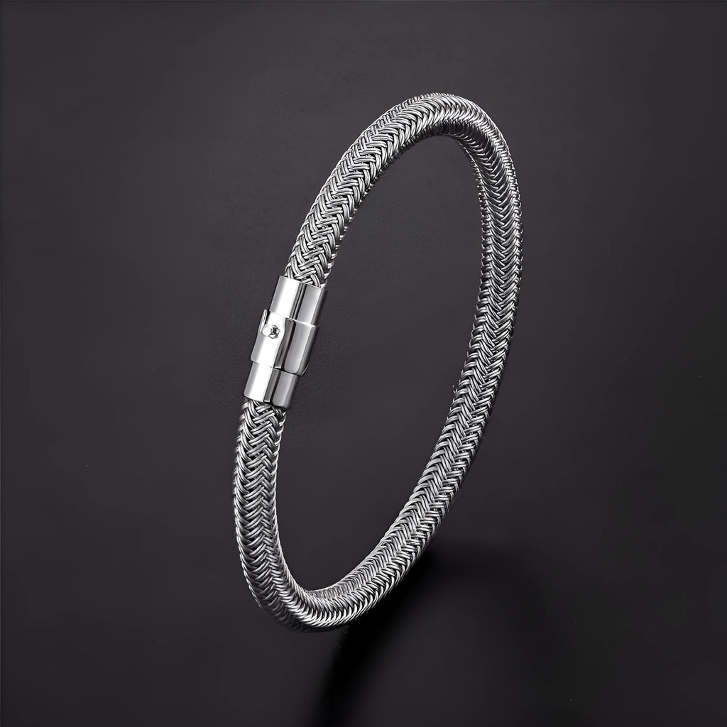 Geometric titanium steel wire bracelet with magnetic clasp on a wrist, shown in a matte grey finish.