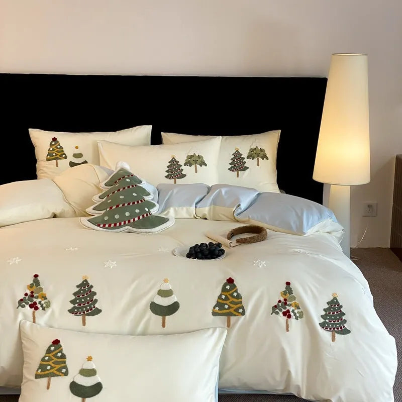 Pure cotton duvet cover and pillowcase set with raised embroidered Christmas tree and floral design in green and cream.