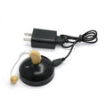 Black rechargeable hearing aid amplifier with silicone earplugs and a charging cable.