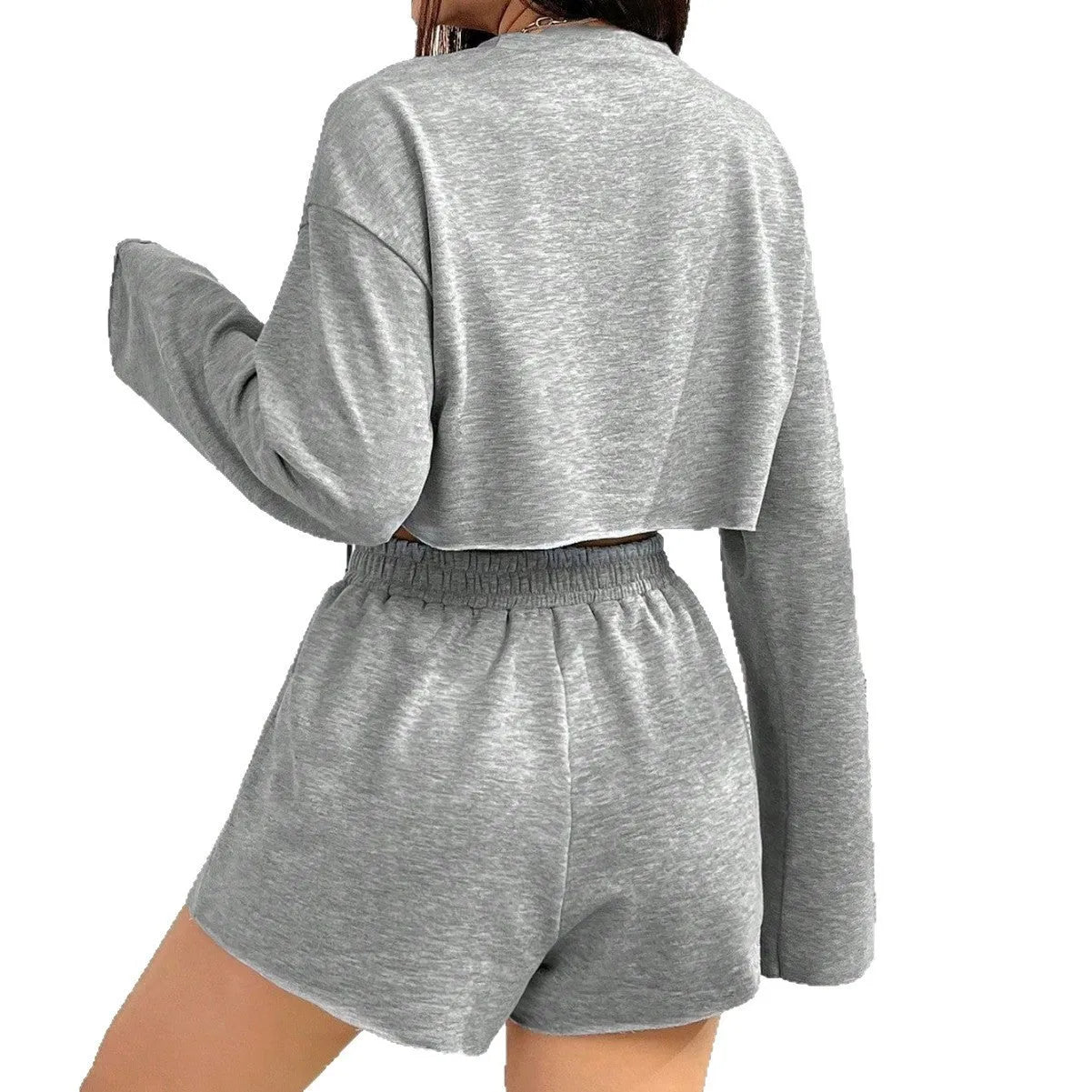 Grey women's long-sleeved t-shirt and short loungewear set laid flat showing both pieces