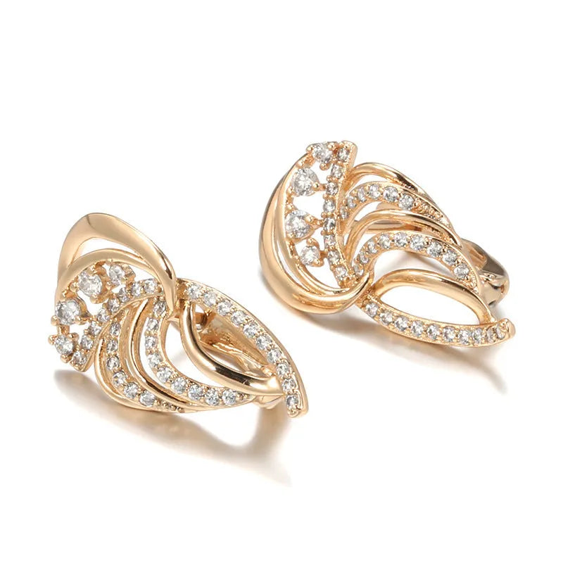 Gold-plated copper women's ear clips with wing design and micro inlaid zircon stones.