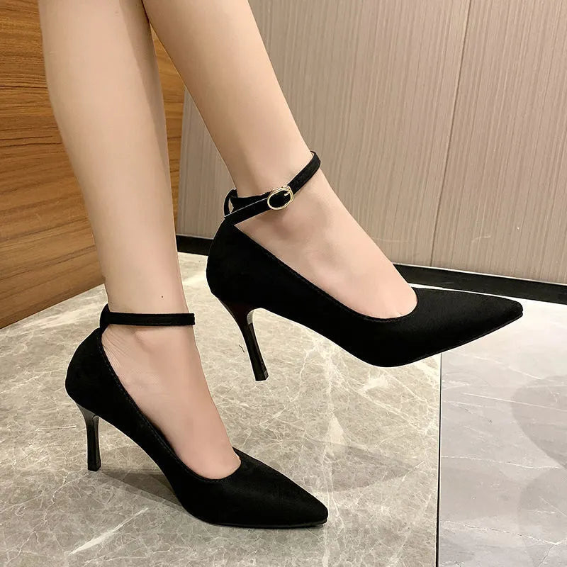 Women's black stiletto heel pump shoes with buckle detail and skull pattern lining