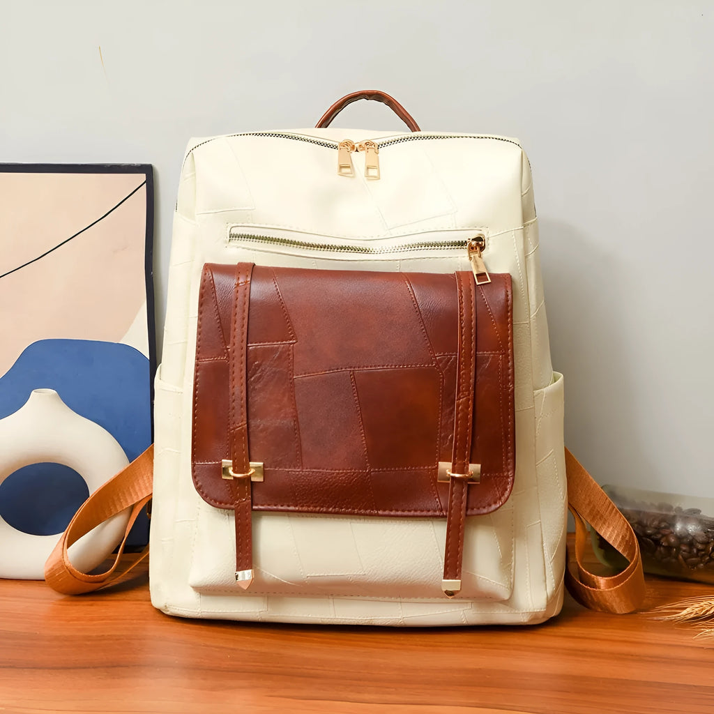 Retro brown PU leather women's backpack with front pockets and top handle.
