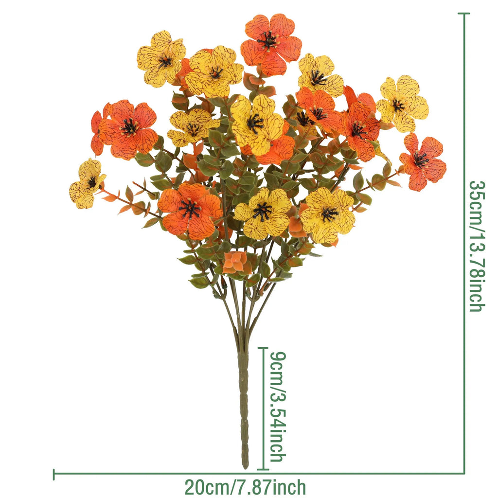 Artificial silk flower bouquet in autumn red, yellow, and orange colours for home or wedding decoration.
