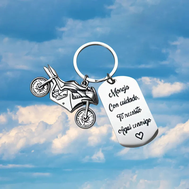 Stainless steel motorcycle keychain with minimalist design in a flannel gift bag.