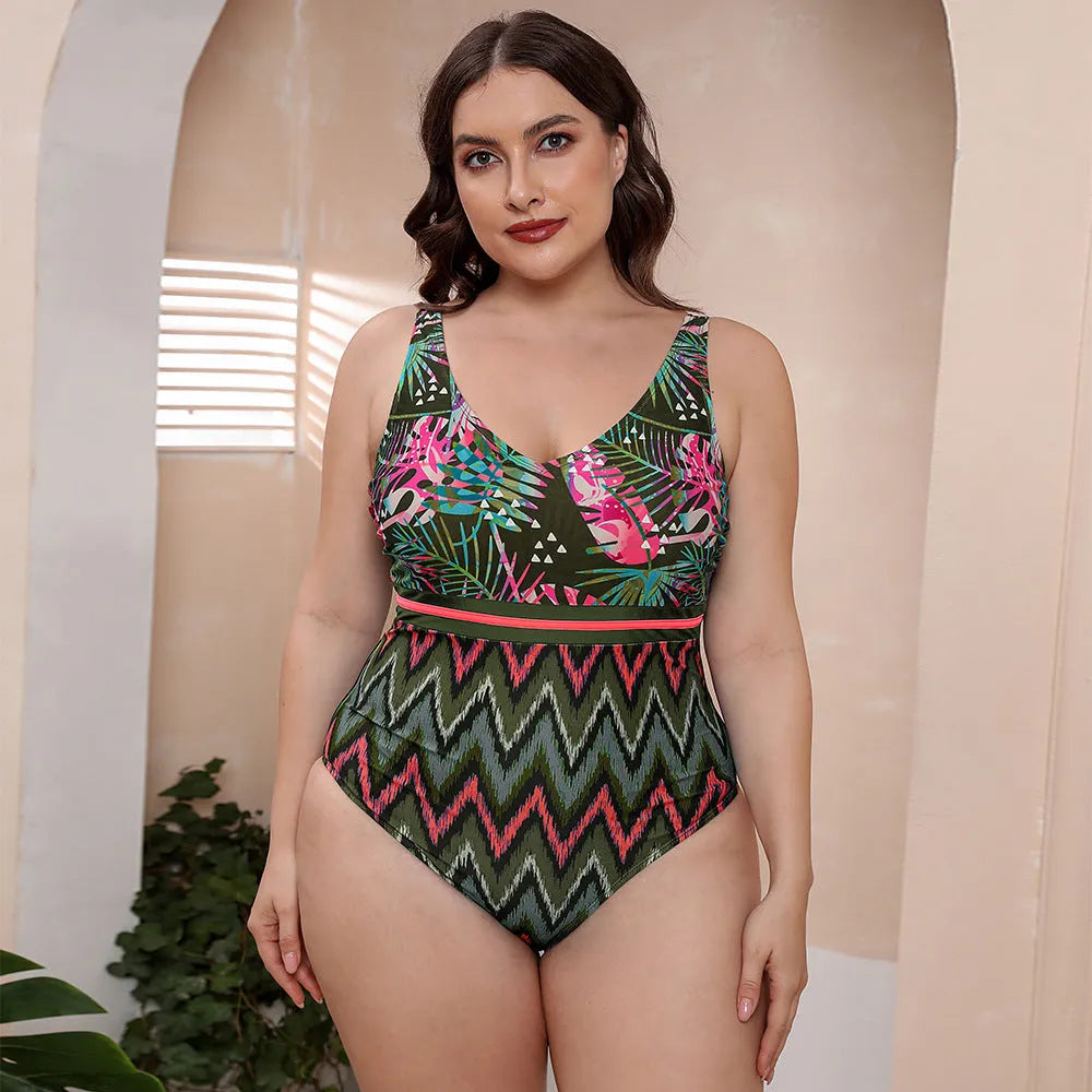 Women's blue printed one-piece swimsuit with spaghetti straps on a mannequin.