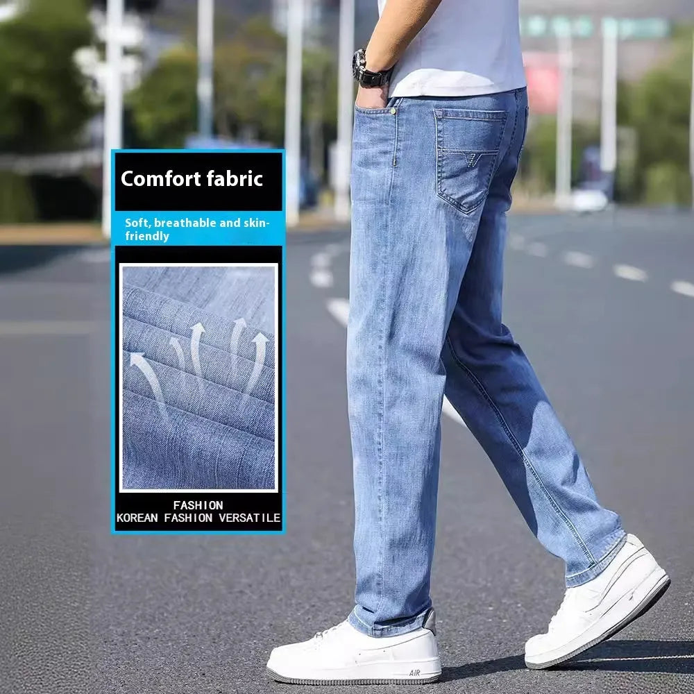 Tapered fit stretch denim trousers for business casual wear in light blue, grey, blue-grey, or black.