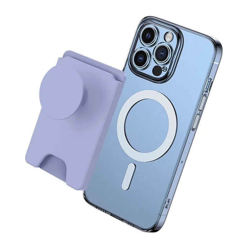 Black magnetic phone airbag holder on office desk with Apple iPhone