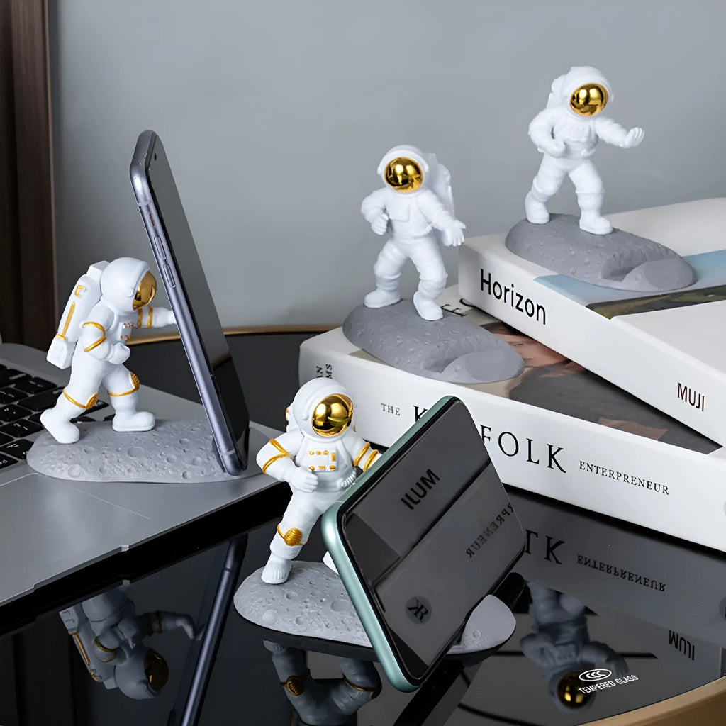 Astronaut decoration spaceman plastic mobile phone holder in blue, gold, and silver colours for lazy binge-watching