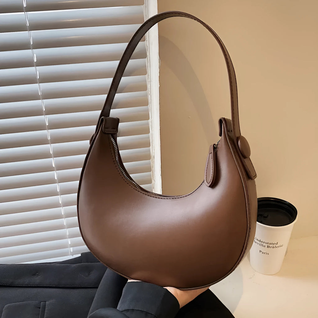 Retro dumpling-shaped women's shoulder bag in PU, shown in cream yellow, with dimensions 21x20x6cm.