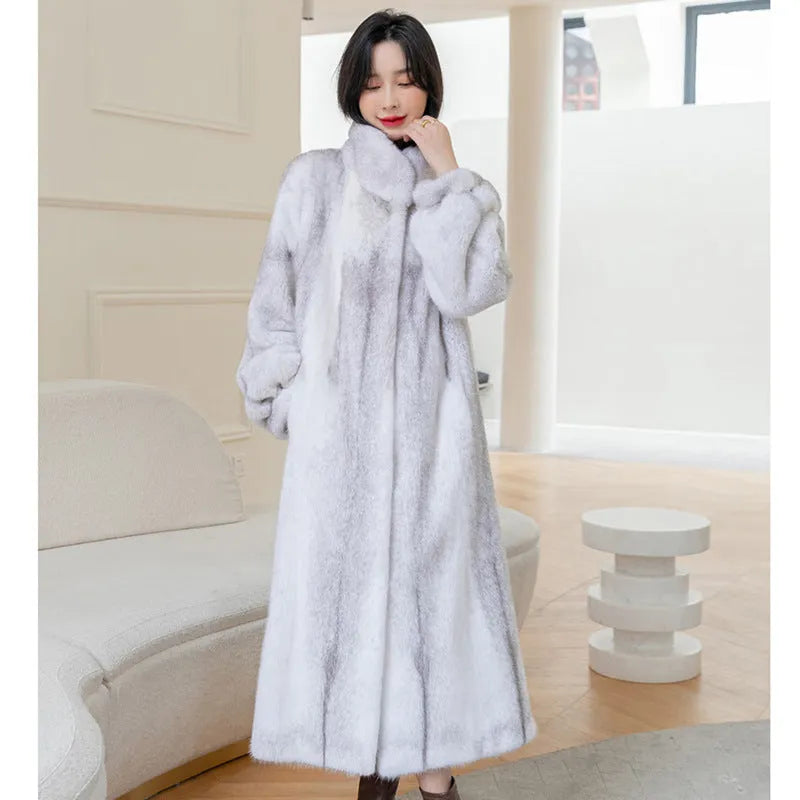 White faux fur coat with a stand-up collar and regular sleeves on a female model.