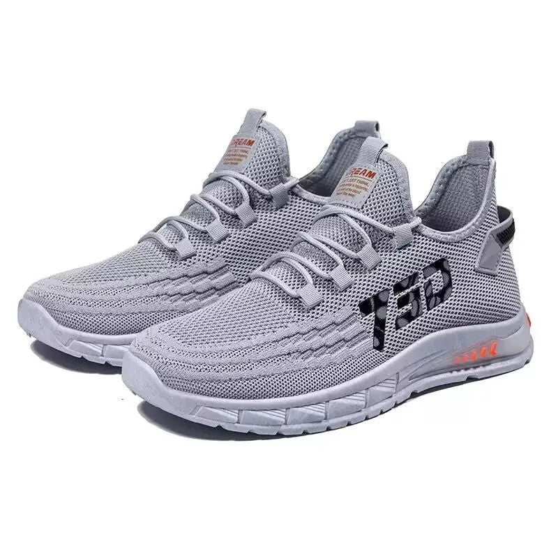 Low-top striped mesh sneaker with flat plastic sole in black colour