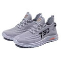Low-top striped mesh sneaker with flat plastic sole in black colour