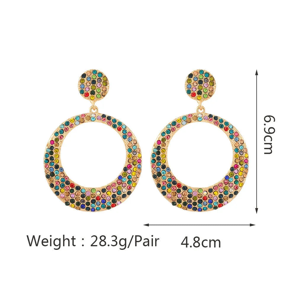 Coloured cartoon-style alloy earrings with a large round pendant and diamond design.