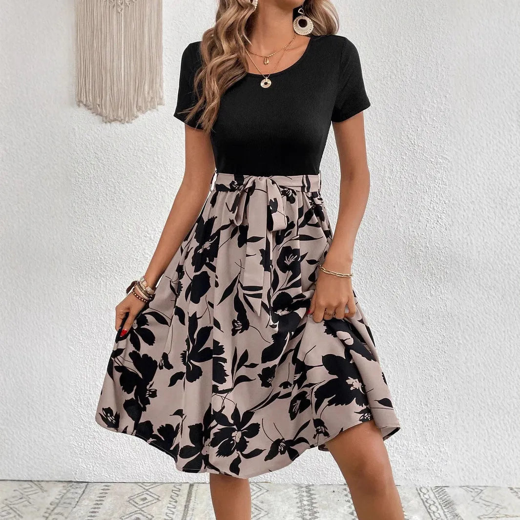 Women's khaki A-line dress with printed floral pattern and lace-up shoulder detail.