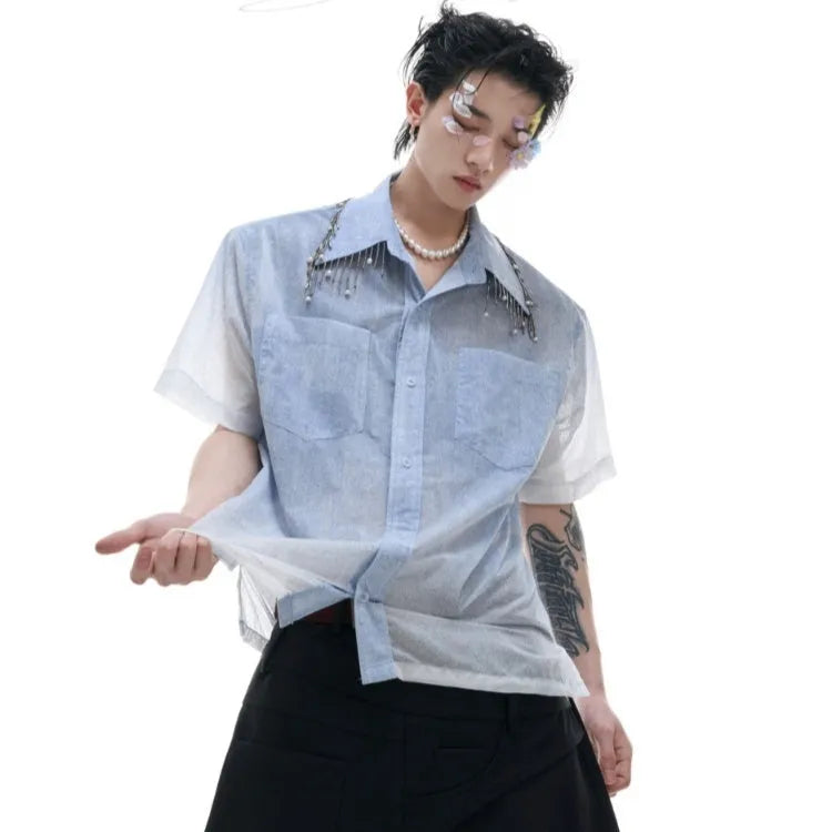 Blue and white gradient loose short shirt with half sleeves on a hanger.