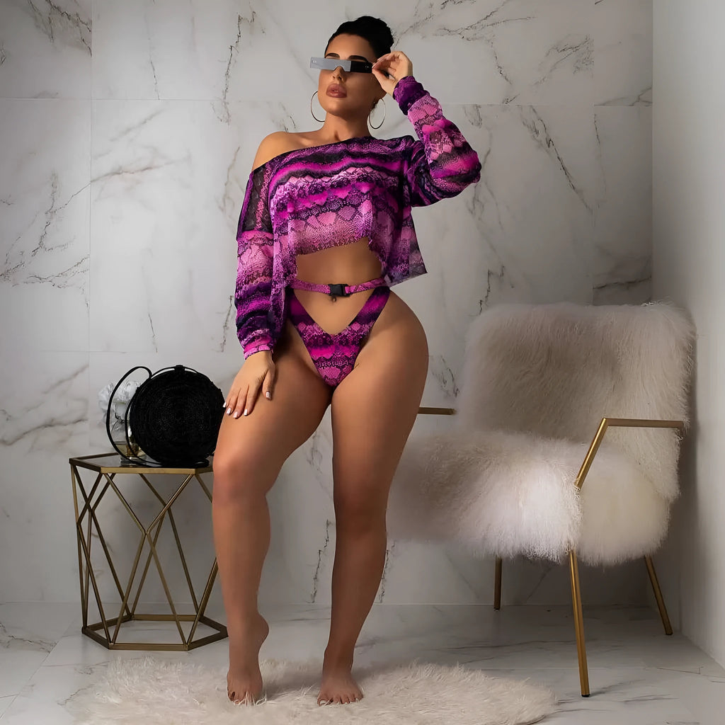 Women's purple snakeskin floral print long-sleeve swimsuit top and matching bikini bottoms.