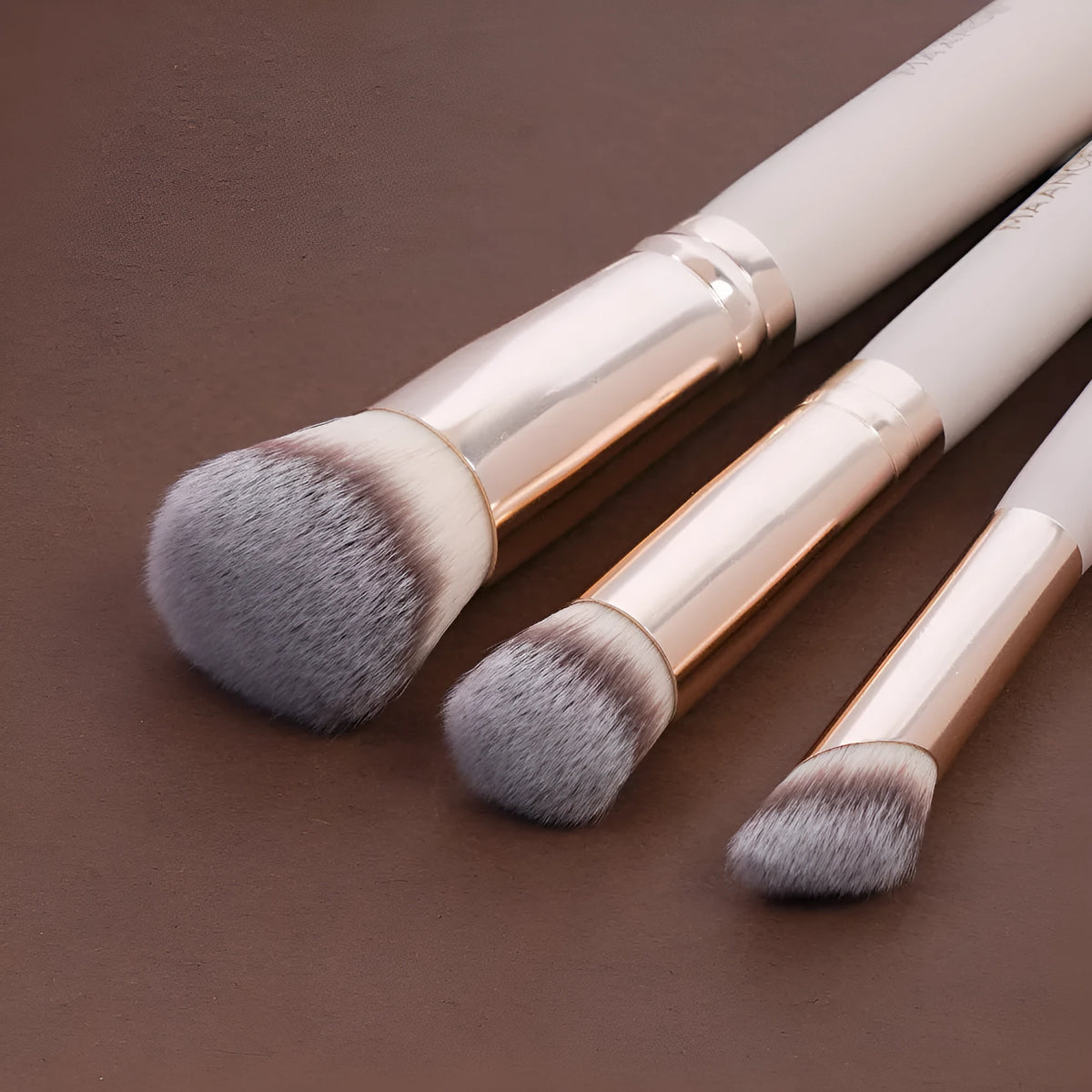 3-piece wooden makeup brush set with triangle powder puff in apricot, black, black gold, and black silver colours