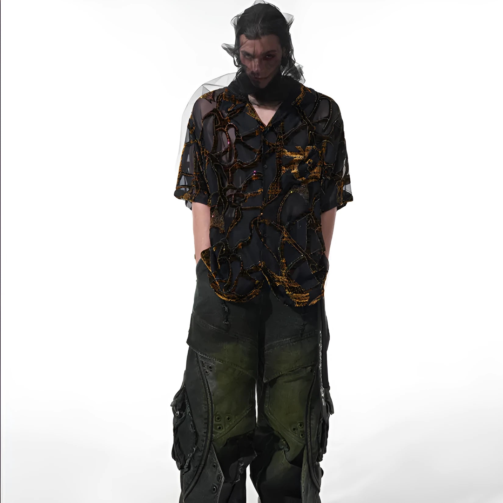 Man wearing a black and grey translucent snake pattern short-sleeved shirt with a lapel collar.