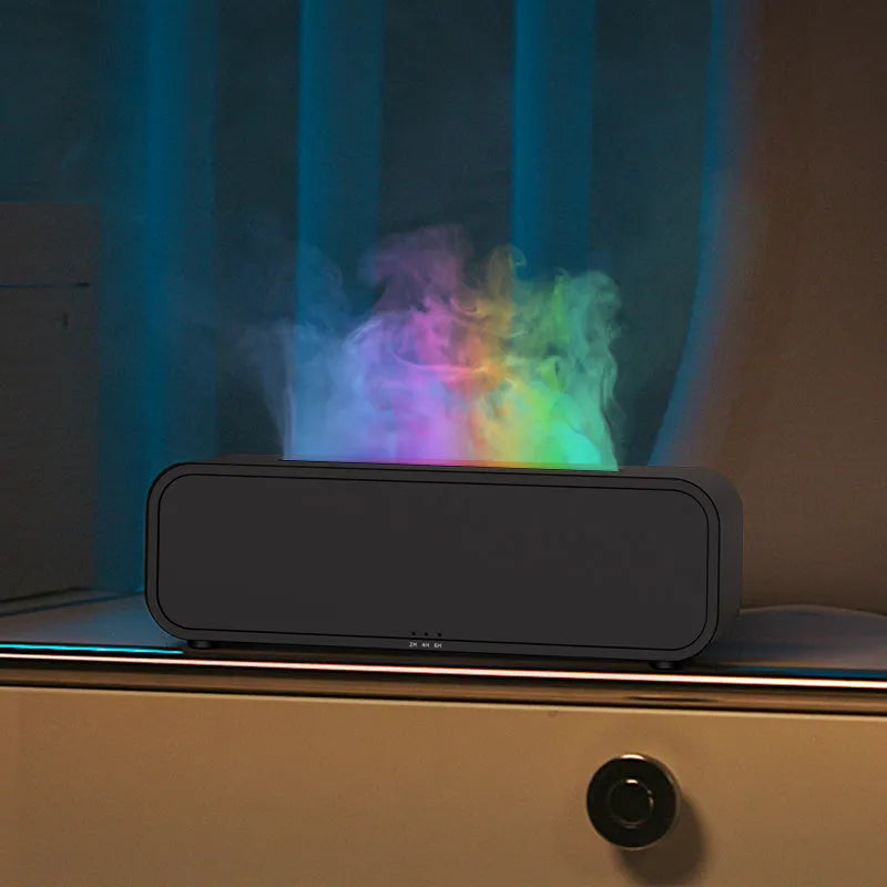 Black Flame Dynamic Aroma Diffuser with LED flame light display and remote control on a desk.