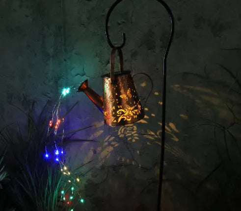 Solar-powered iron garden lamp with butterfly pattern and warm white LED light